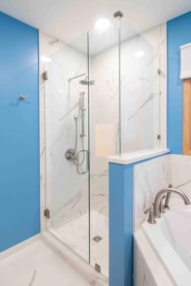 remodeled bathroom with soaking tub and glass shower enclosure by Odd Fellows Contracting in Okemos MI
