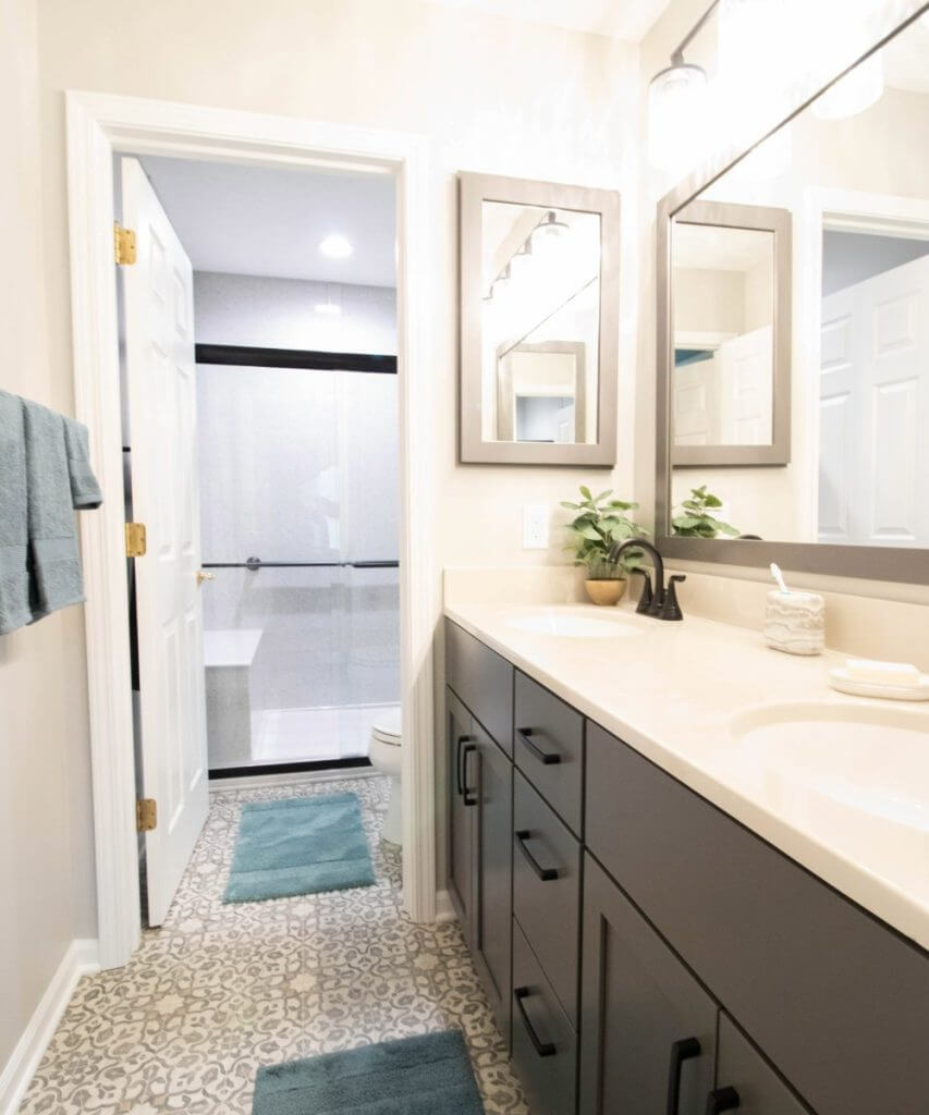 bathroom remodel with modern vanity cabinetry and tile flooring by Odd Fellows Contracting in East Lansing MI