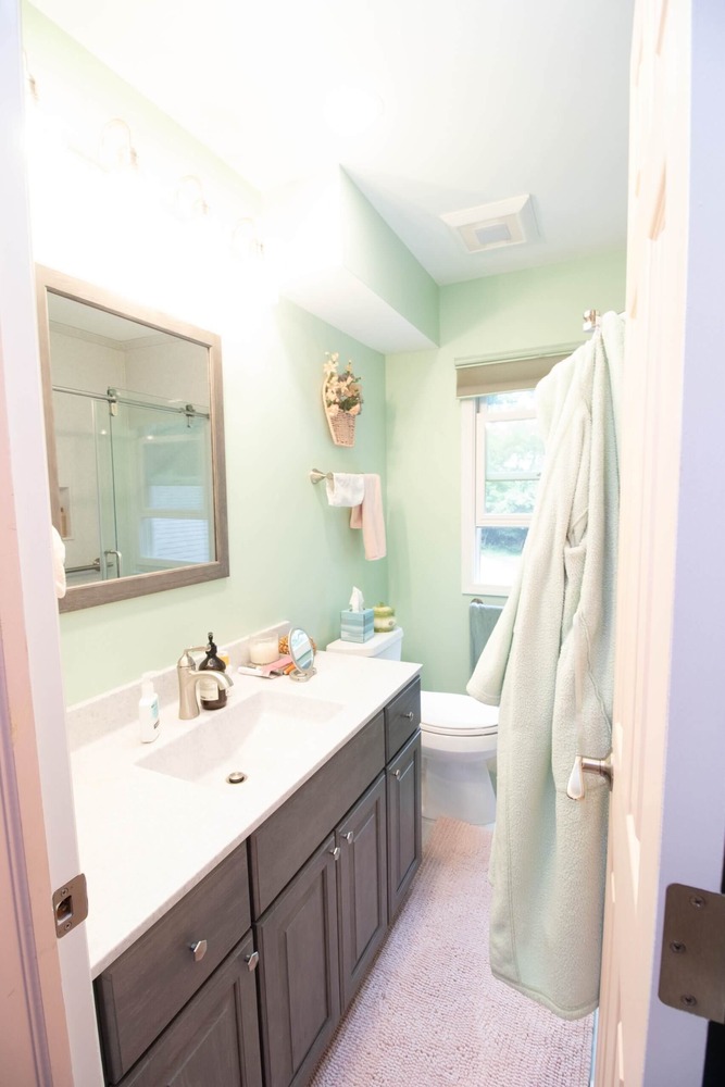 bathroom remodel featuring updated vanity, sink, and mirror by Odd Fellows Contracting in Williamston MI