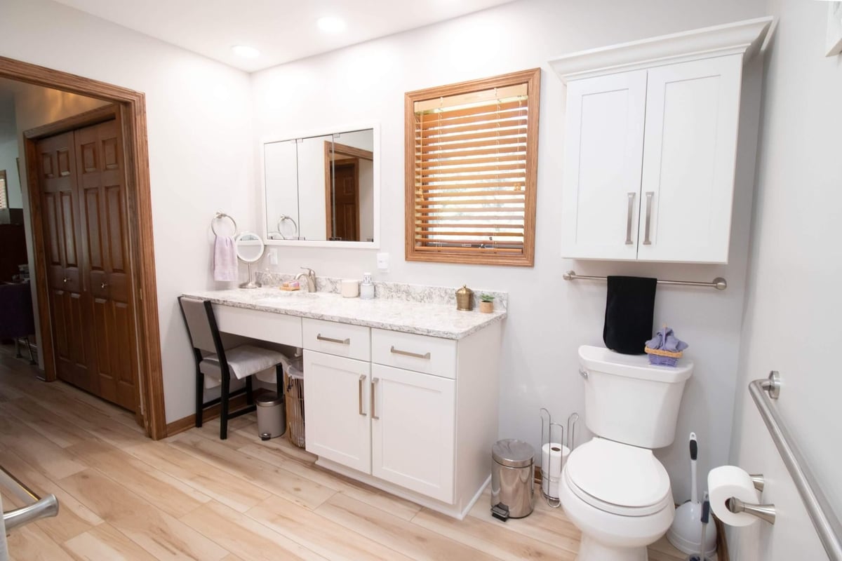 bathroom remodel featuring modern vanity, mirror, and lighting by Odd Fellows Contracting in Mason MI