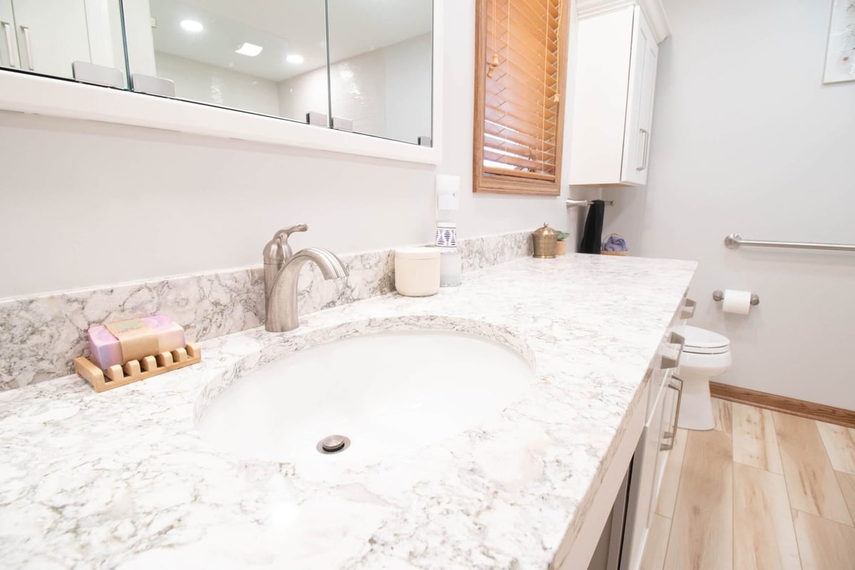 finished bathroom renovation with updated vanity and countertop by Odd Fellows Contracting in Mason MI