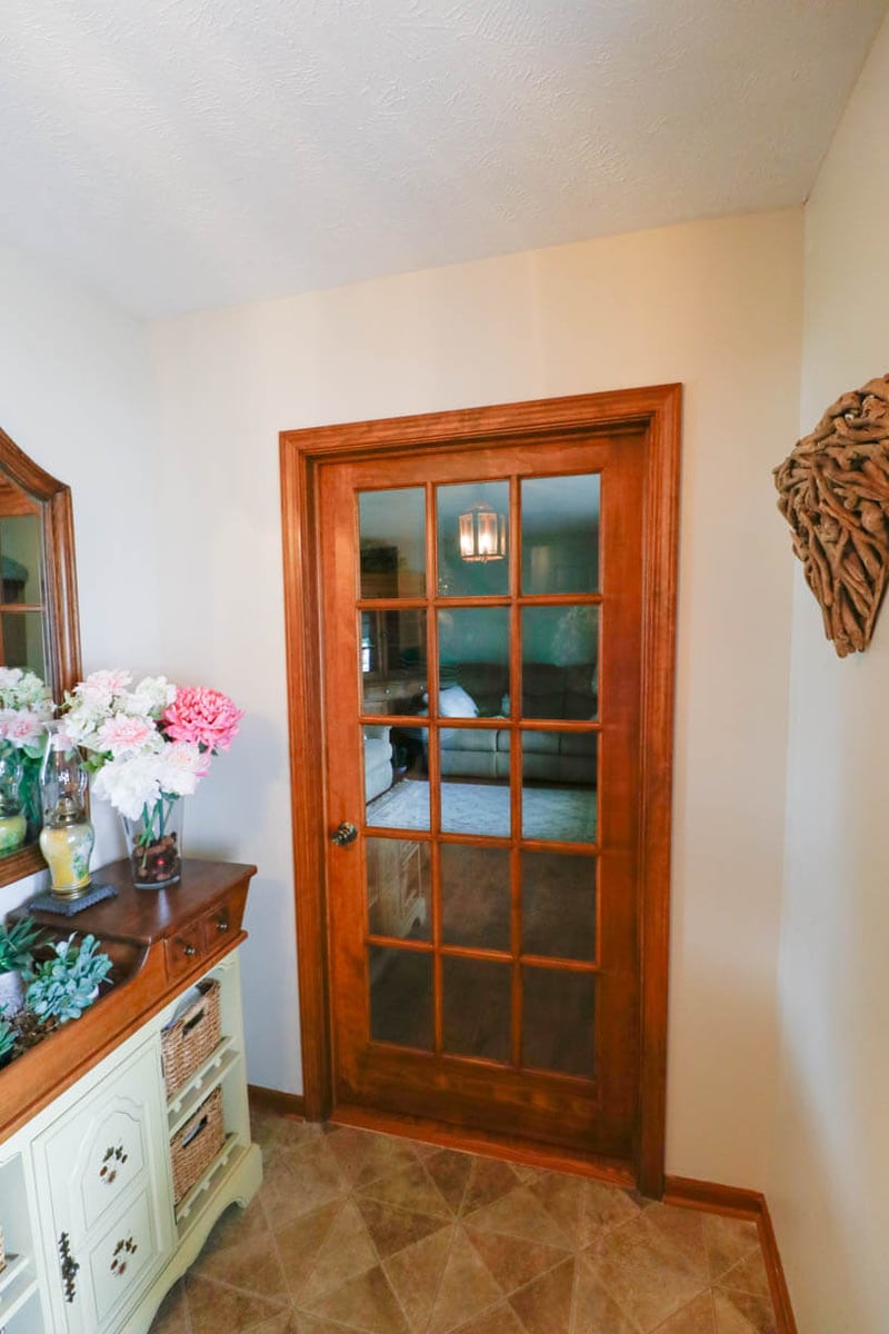 Interior door and flooring updated during bathroom remodel by Odd Fellows Contracting in Holt, MI.