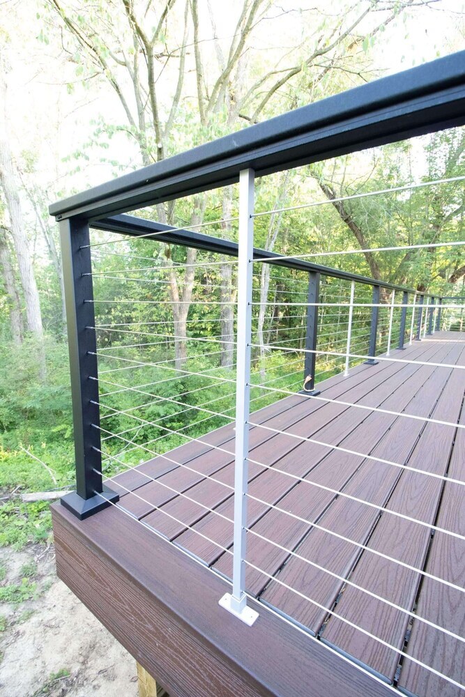 cable railing detail on composite deck by Odd Fellows Contracting in Haslett, MI