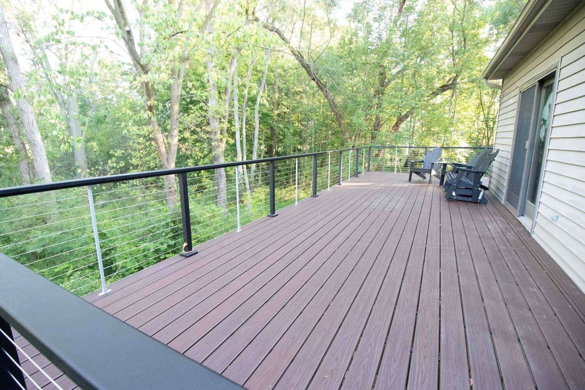 composite deck with outdoor seating area and wooded view in Haslett, MI