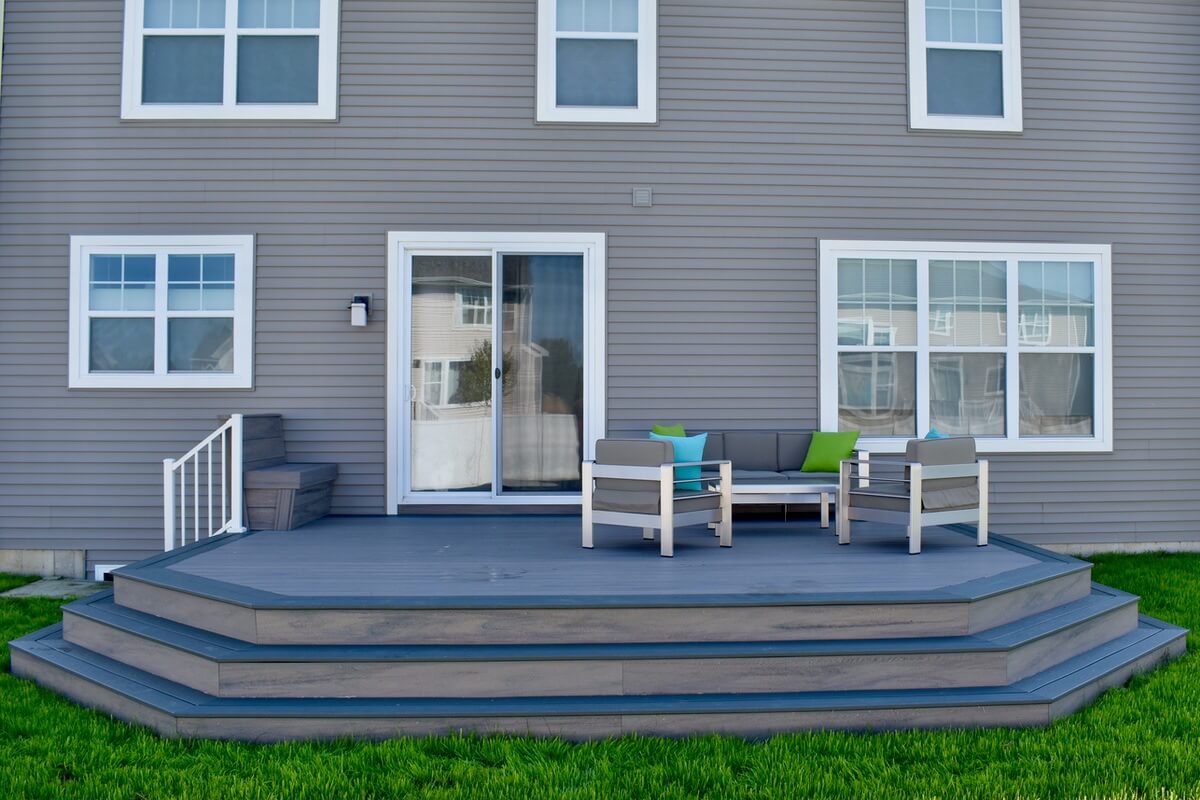 finished backyard deck build with tiered steps in Okemos, MI