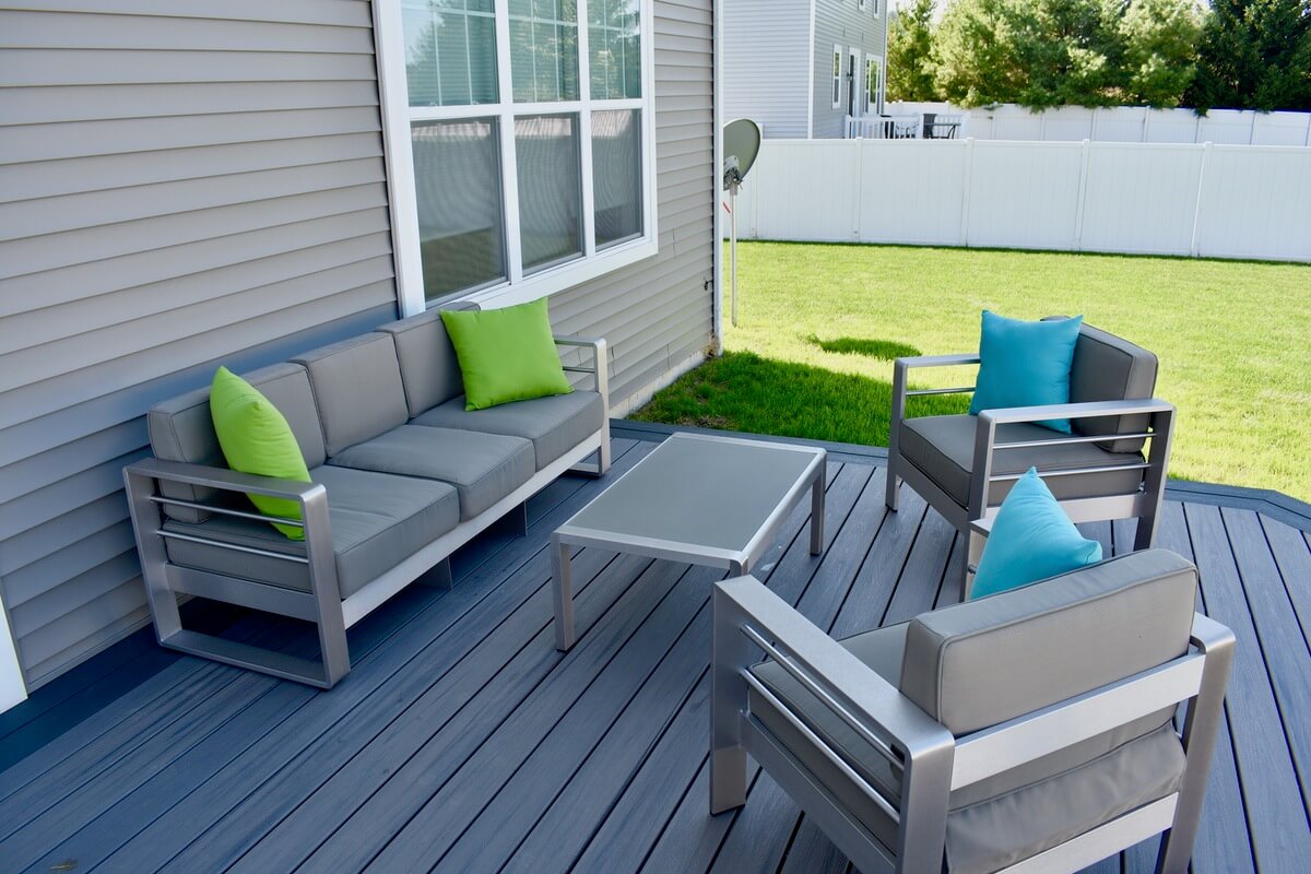 modern composite backyard deck with outdoor seating built by Odd Fellows Contracting in Okemos, MI