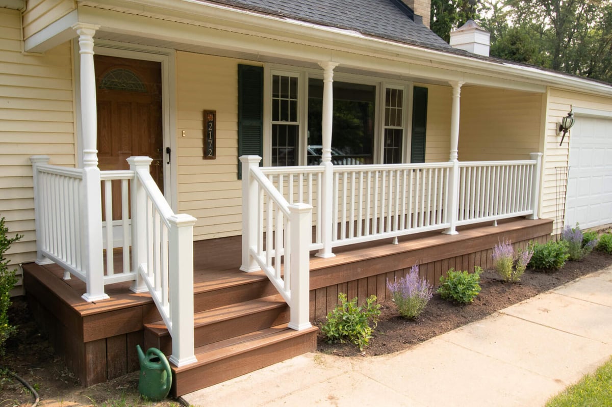 updated home entrance with renovated front porch and railings by Odd Fellows Contracting East Lansing MI
