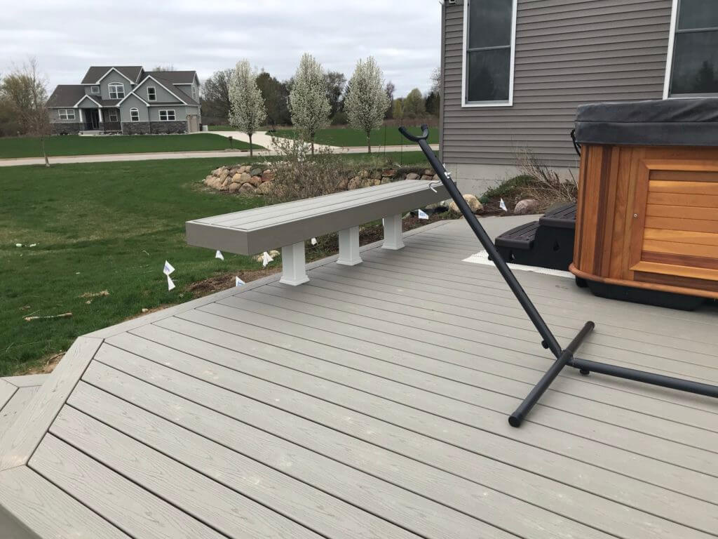 Expanded backyard deck entertainment space built by Odd Fellows Contracting Haslett MI