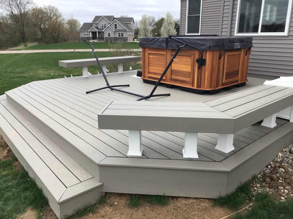 Multi-level composite deck extension with hot tub area in Haslett MI