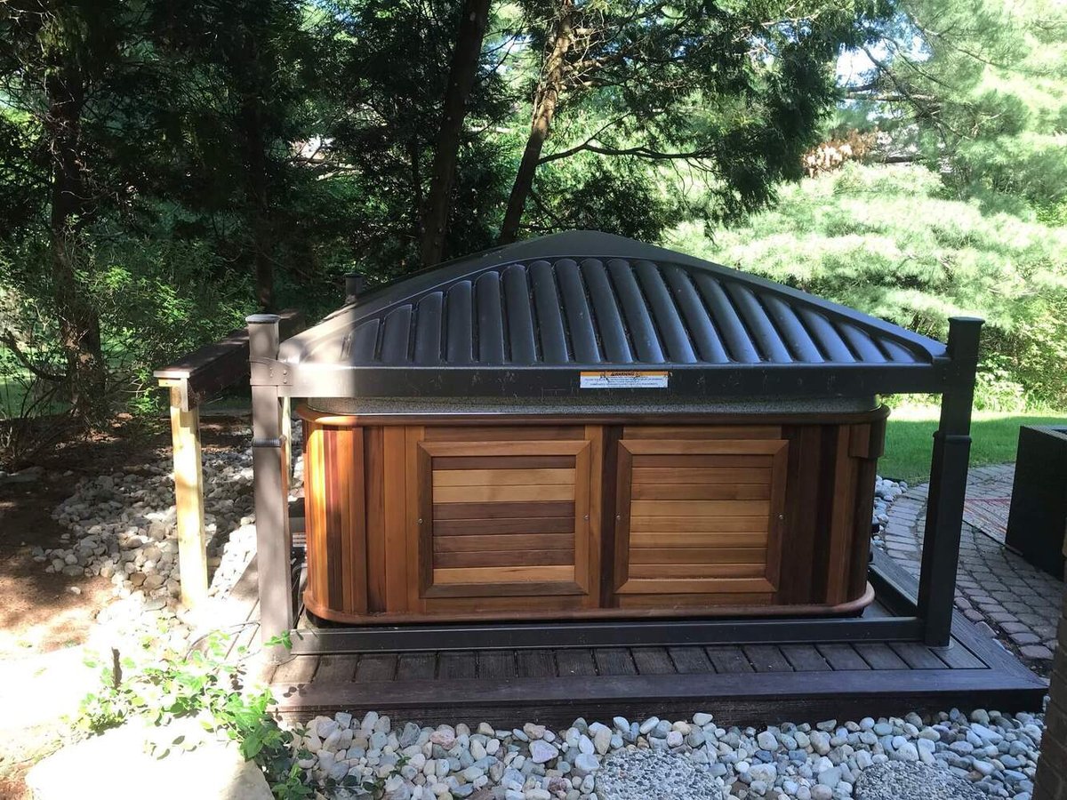 Backyard spa deck installation by Odd Fellows Contracting Okemos Michigan