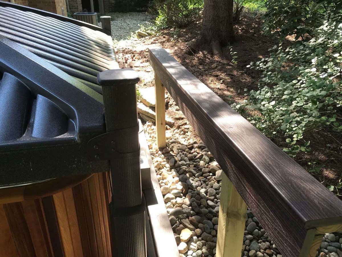 Backyard spa safety railing and seating detail by Odd Fellows Contracting