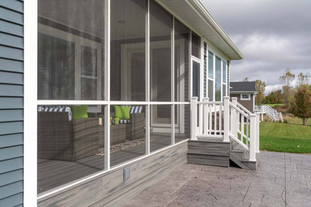 outdoor living space addition with patio and screened enclosure by Odd Fellows Contracting in Okemos MI