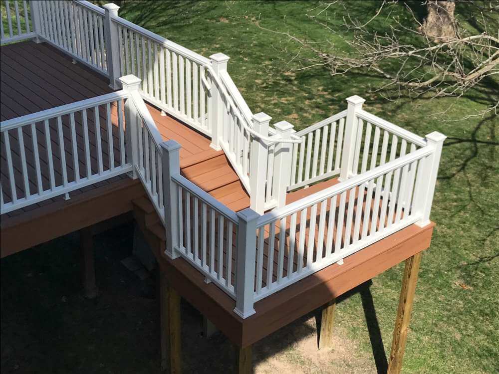 close view of deck stairs and railing renovation by Odd Fellows Contracting in Holt Michigan