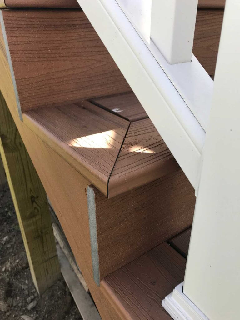 white deck railing detail on composite deck by Odd Fellows Contracting in Holt MI