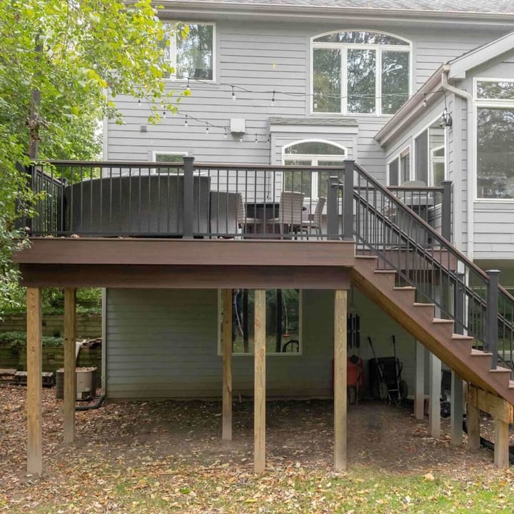 New Trex composite deck with railing and stairs built by Odd Fellows Contracting in Okemos, MI