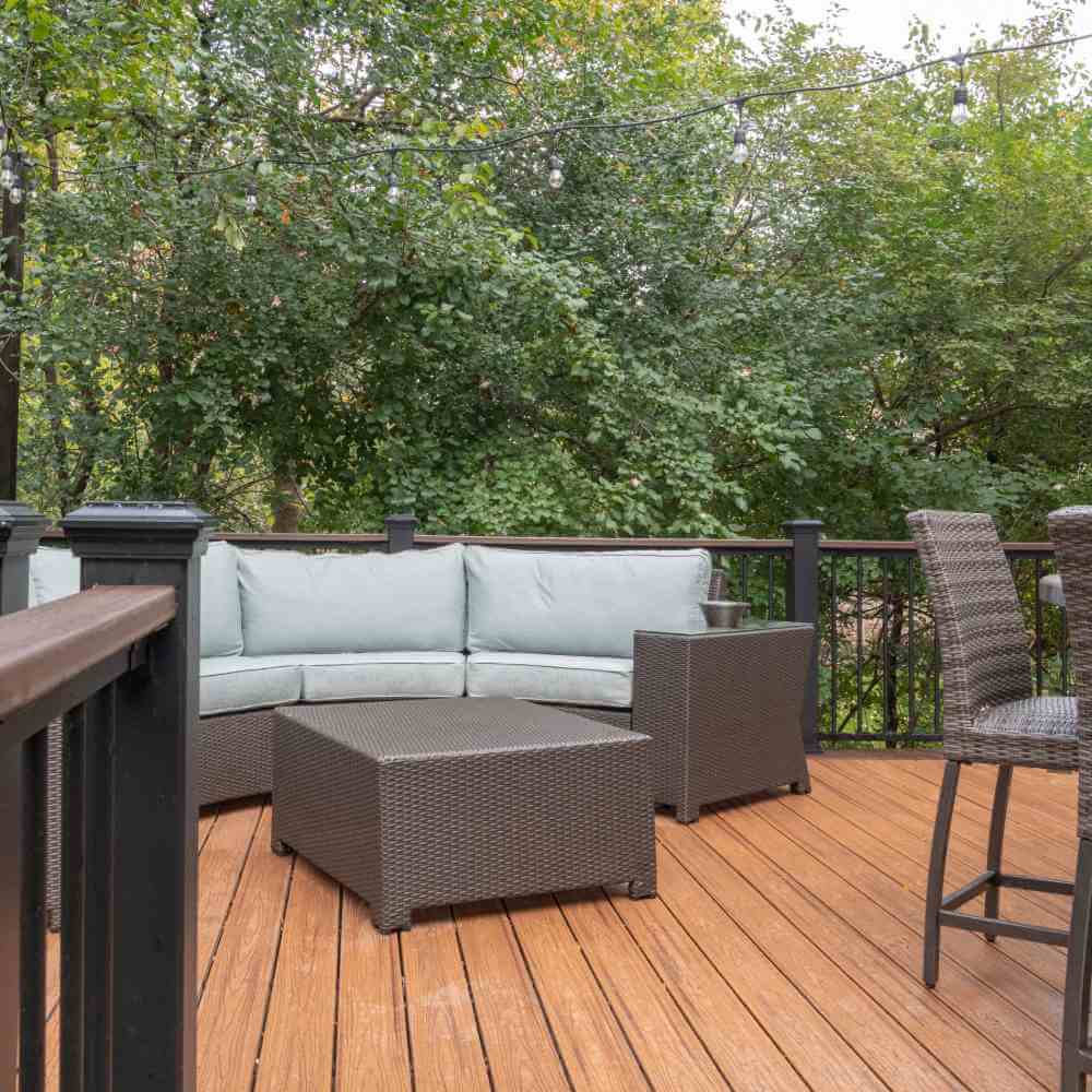 Outdoor Trex deck seating area with patio furniture built by Odd Fellows Contracting in Okemos Michigan