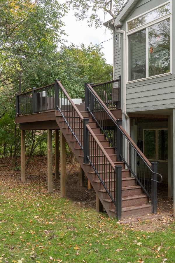 Trex deck stairs with modern railing installed by Odd Fellows Contracting in Okemos Michigan