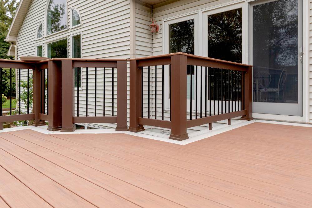 Backyard deck renovation with composite decking by Odd Fellows Contracting in Lansing MI