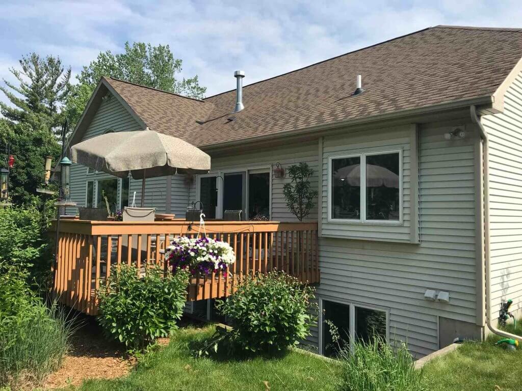 Backyard wood deck before renovation by Odd Fellows Contracting in Lansing Michigan