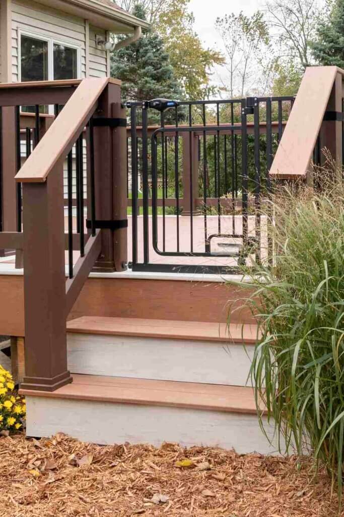 Deck entry stairs with composite decking and railing in Lansing MI outdoor living renovation