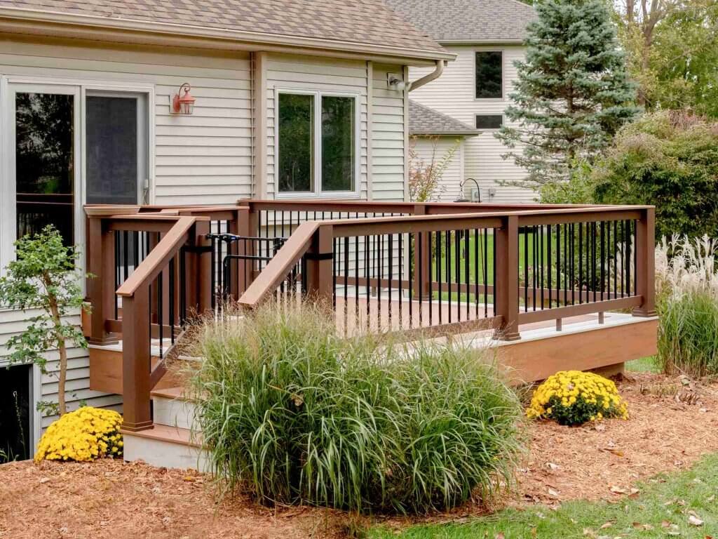 New composite deck with modern railing built by Odd Fellows Contracting in Lansing MI