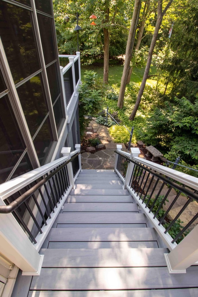 deck remodel showing lattice enclosure and landscaped patio below by Odd Fellows Contracting in Williamston MI