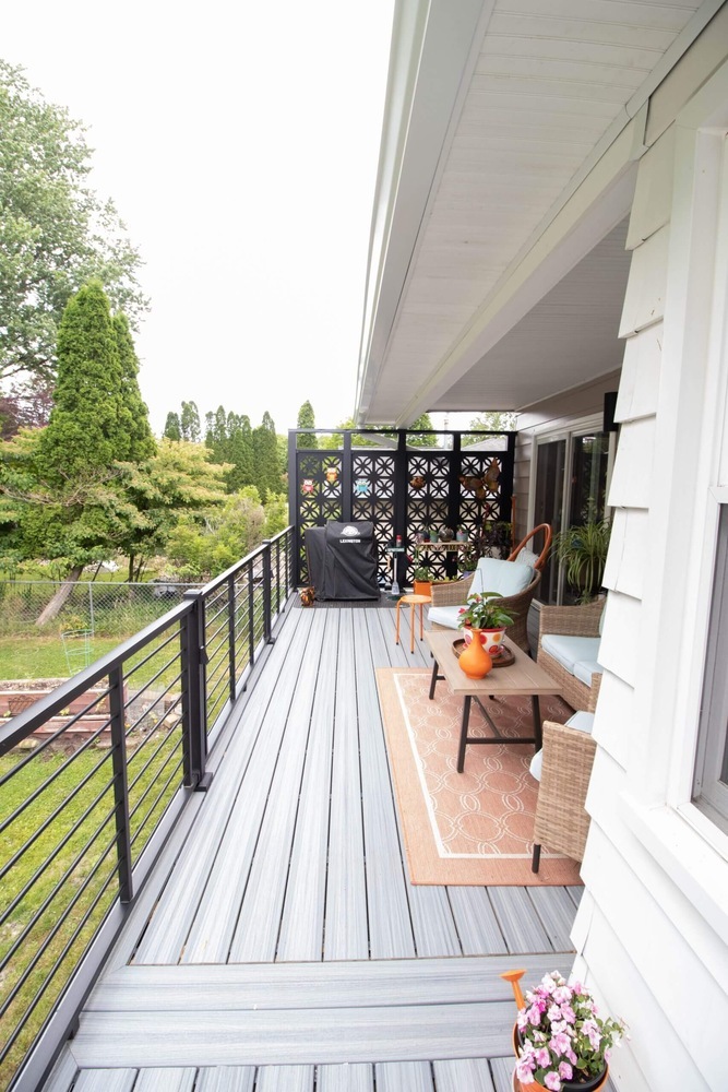backyard deck renovation featuring composite decking and railing system by Odd Fellows Contracting in Lansing MI