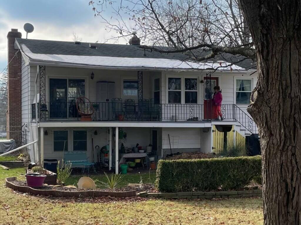 original raised deck and porch area before renovation by Odd Fellows Contracting in Lansing MI