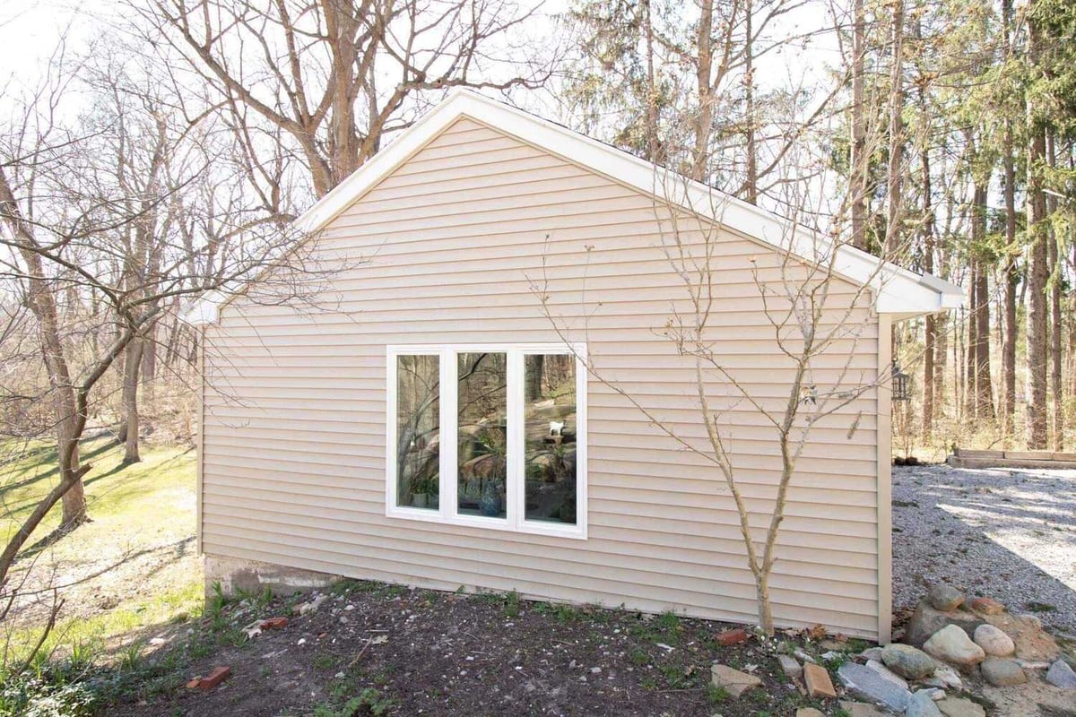 finished garage conversion exterior upgrade by Odd Fellows Contracting in Okemos, MI