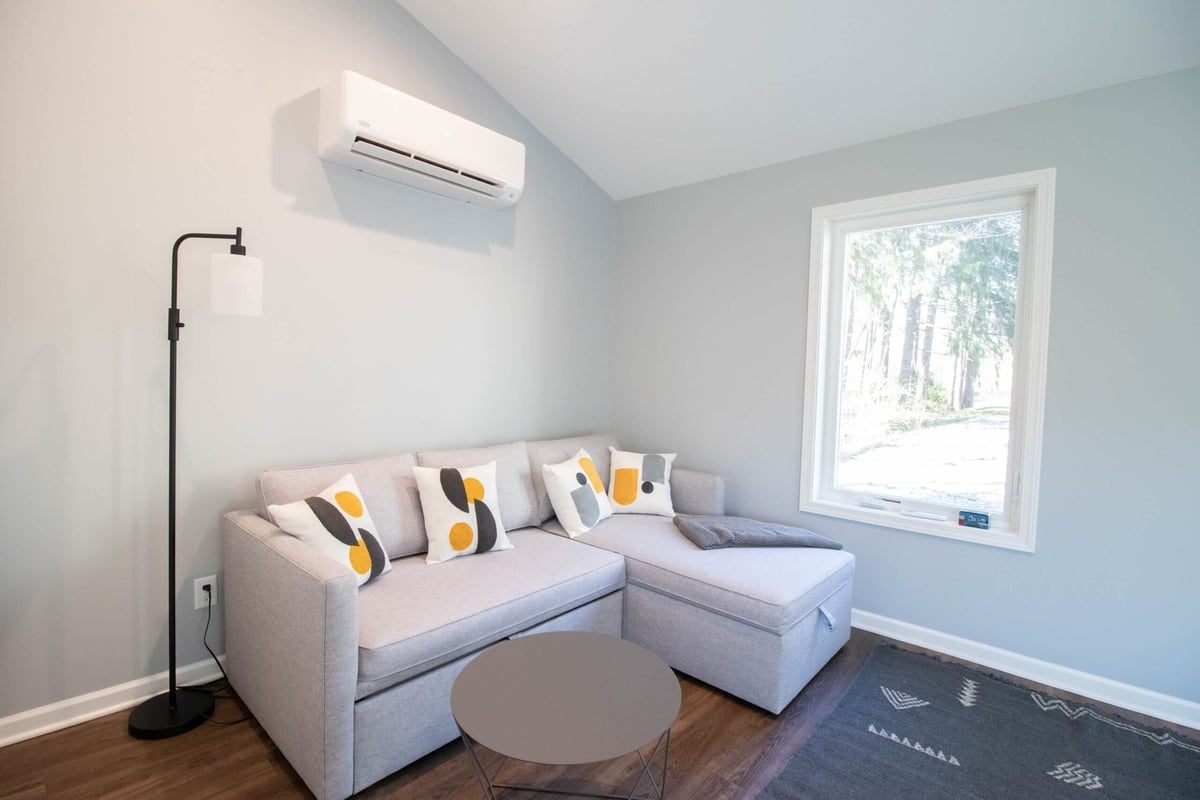 open concept living space created during garage conversion by Odd Fellows Contracting in Okemos, MI