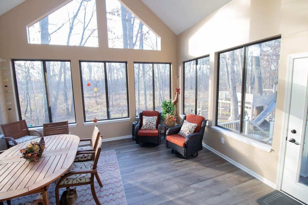 finished four seasons room with vaulted ceiling and large windows by Odd Fellows Contracting in Haslett MI
