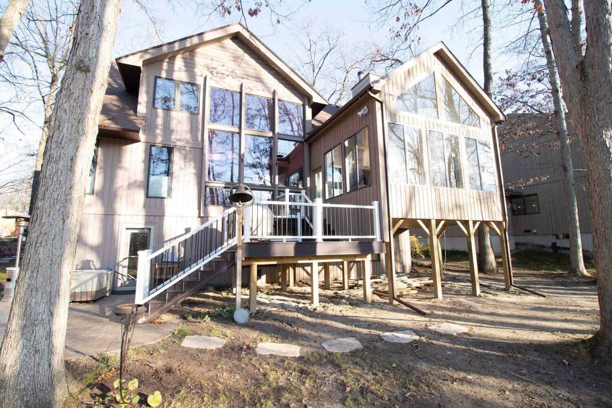 sunroom addition with elevated deck and stairs by Odd Fellows Contracting in Haslett MI