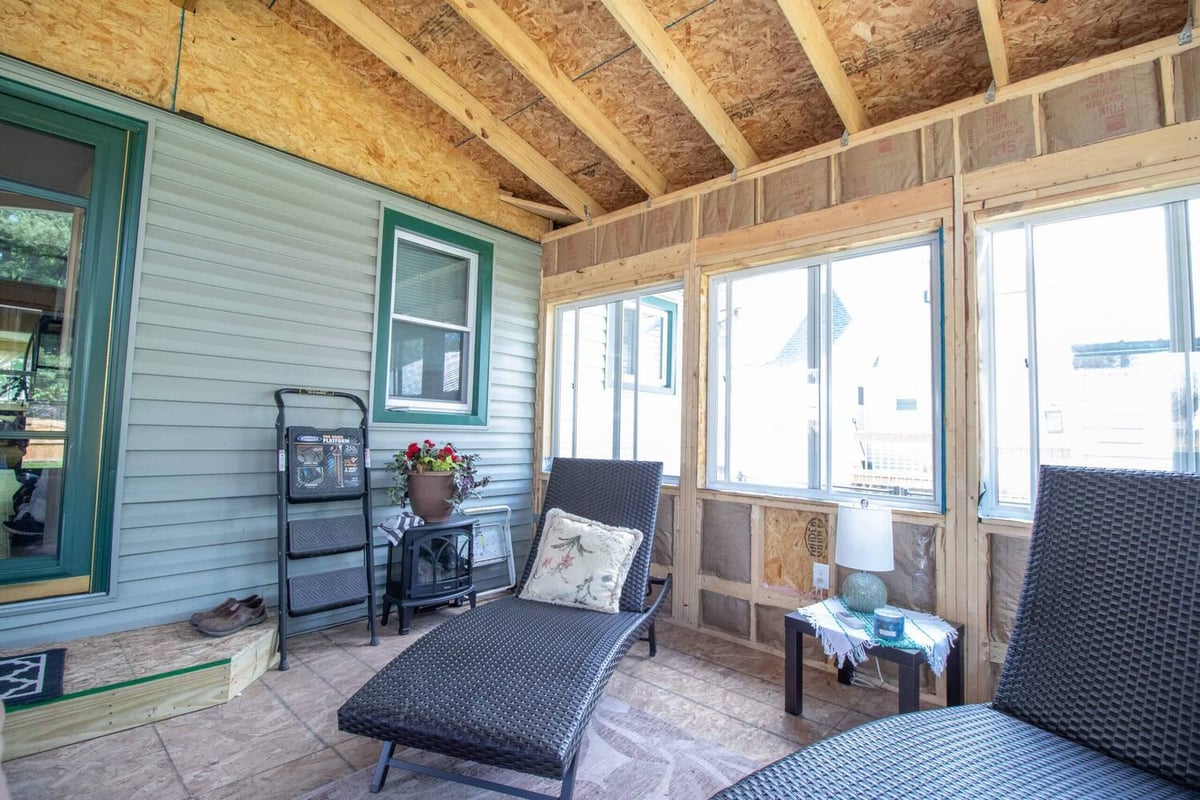 three seasons room interior under construction with exposed framing by Odd Fellows Contracting in Holt, MI