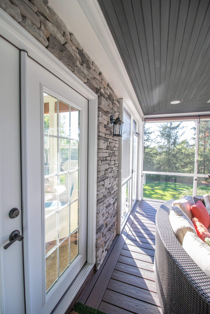 enclosed porch addition with outdoor seating area by Odd Fellows Contracting in Okemos MI