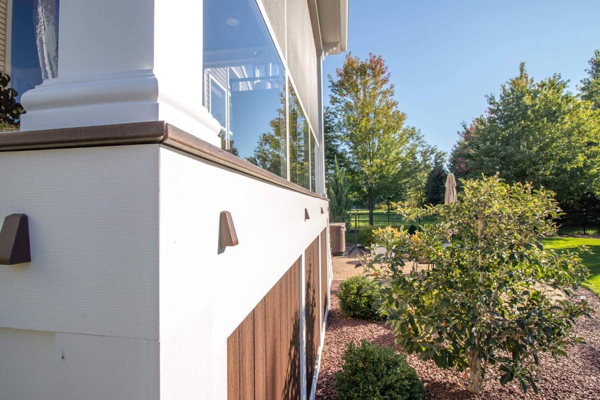 side view of screened three season room addition and landscaping by Odd Fellows Contracting Okemos MI