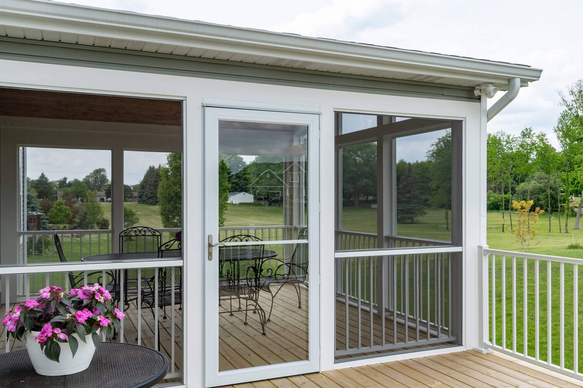 exterior view of screened three season room addition by Odd Fellows Contracting in Lansing MI