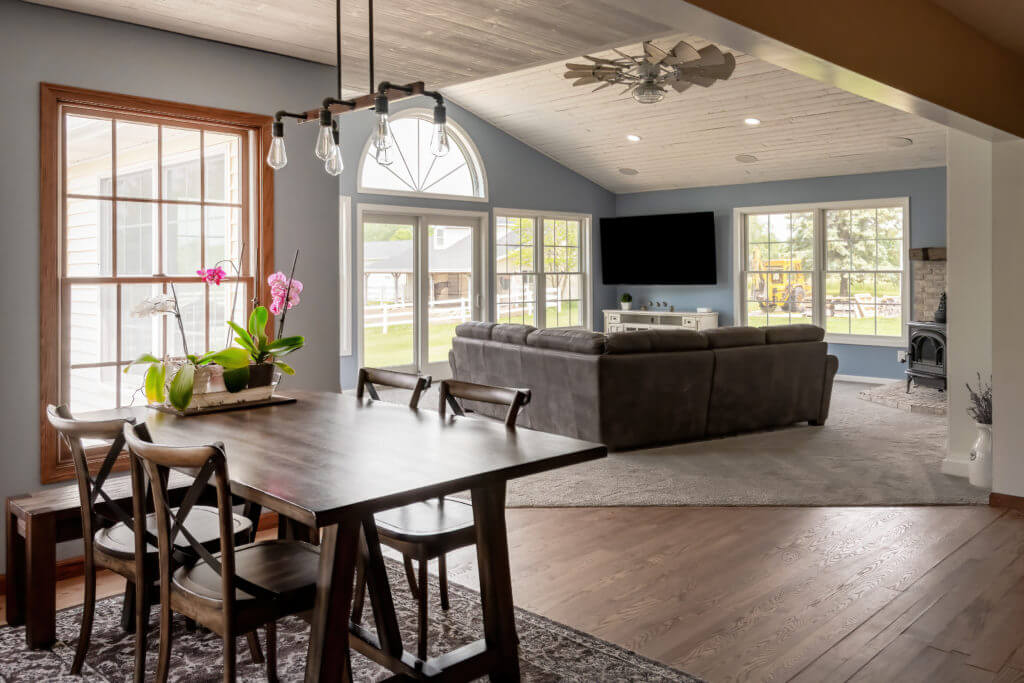 finished family room addition with vaulted ceiling and large windows by Odd Fellows Contracting in Williamston MI