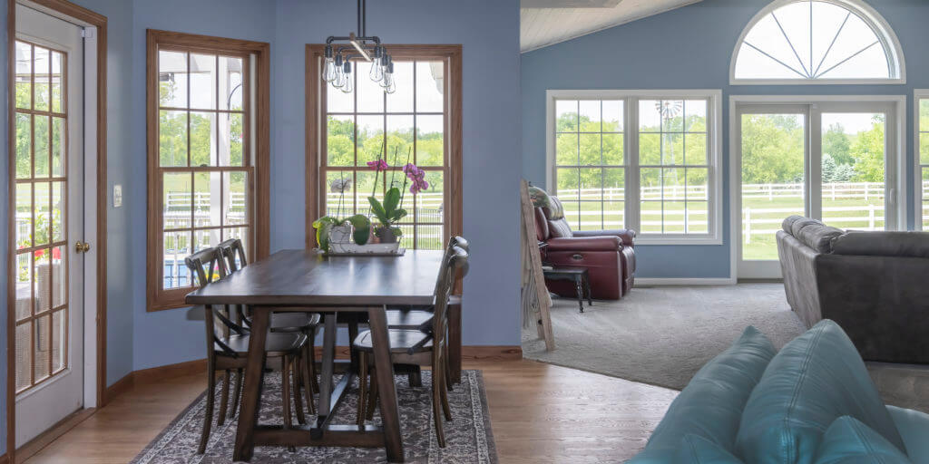open dining and family room addition with large windows by Odd Fellows Contracting in Williamston MI