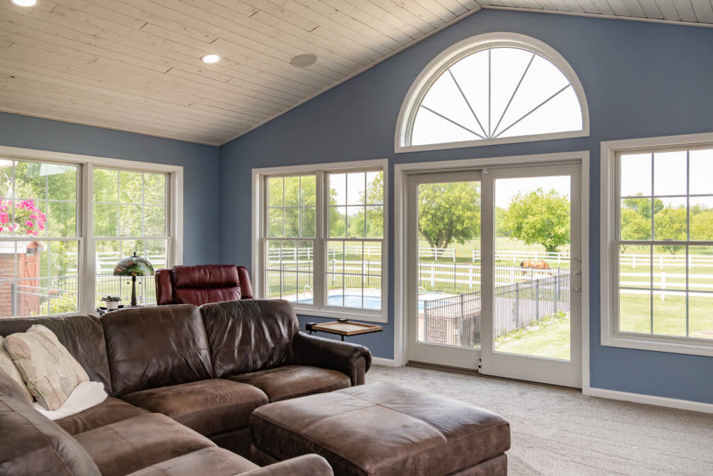 spacious living room addition with vaulted ceiling by Odd Fellows Contracting Williamston MI