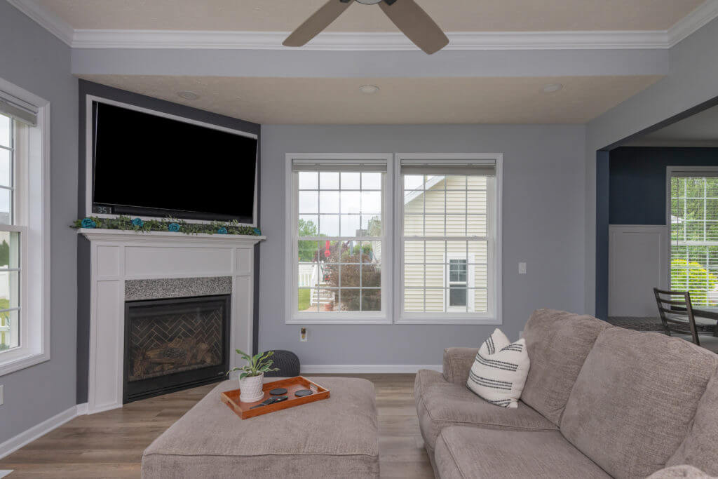 living room addition with fireplace and modern seating area by Odd Fellows Contracting in East Lansing MI
