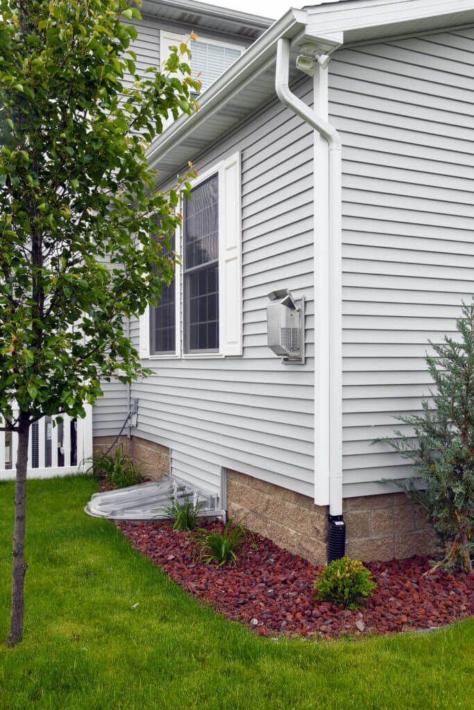 side exterior view of finished home addition with vinyl siding by Odd Fellows Contracting in East Lansing MI