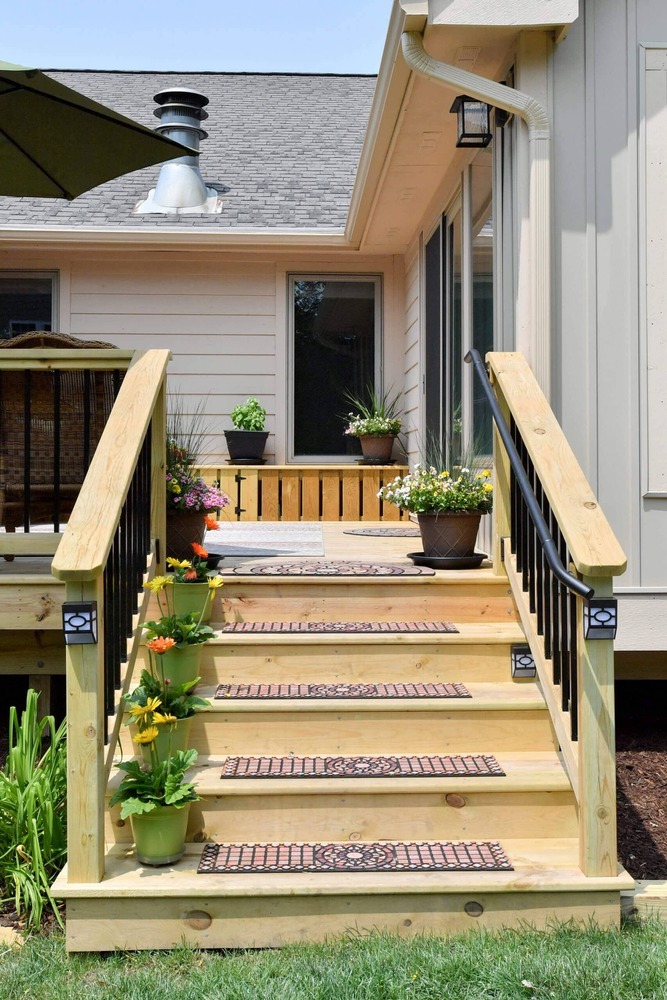 deck staircase and landing from backyard deck addition by Odd Fellows Contracting in Okemos, MI