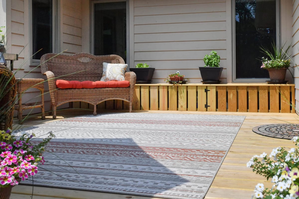 finished deck living space connected to sunroom addition by Odd Fellows Contracting in Okemos, MI