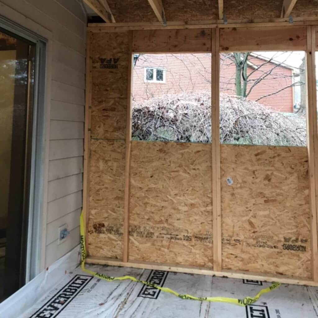 sunroom addition under construction showing wall framing by Odd Fellows Contracting in Okemos, MI