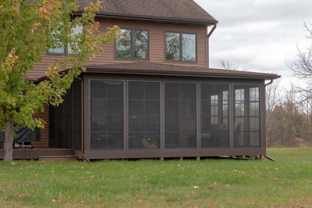 exterior three seasons room addition attached to home by Odd Fellows Contracting in Grand Ledge MI