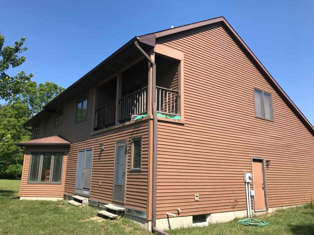 rear exterior of home prior to three seasons room construction by Odd Fellows Contracting in Grand Ledge MI