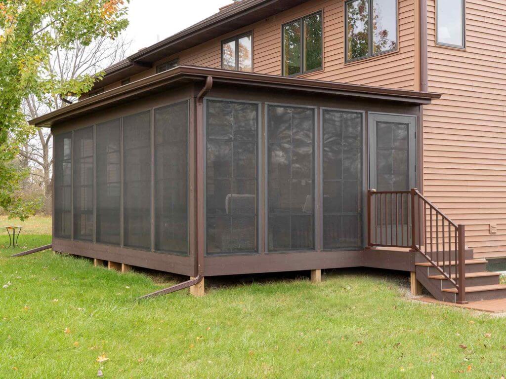 screened three seasons room addition with stairs and deck by Odd Fellows Contracting in Grand Ledge MI