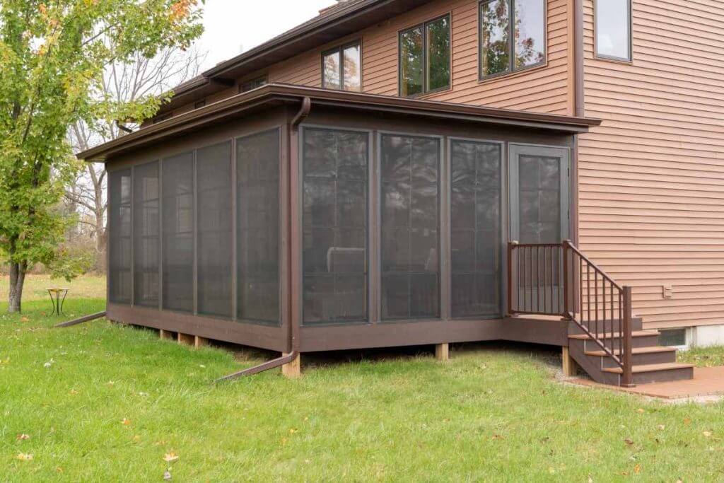 side view of screened porch addition attached to home by Odd Fellows Contracting in Grand Ledge MI