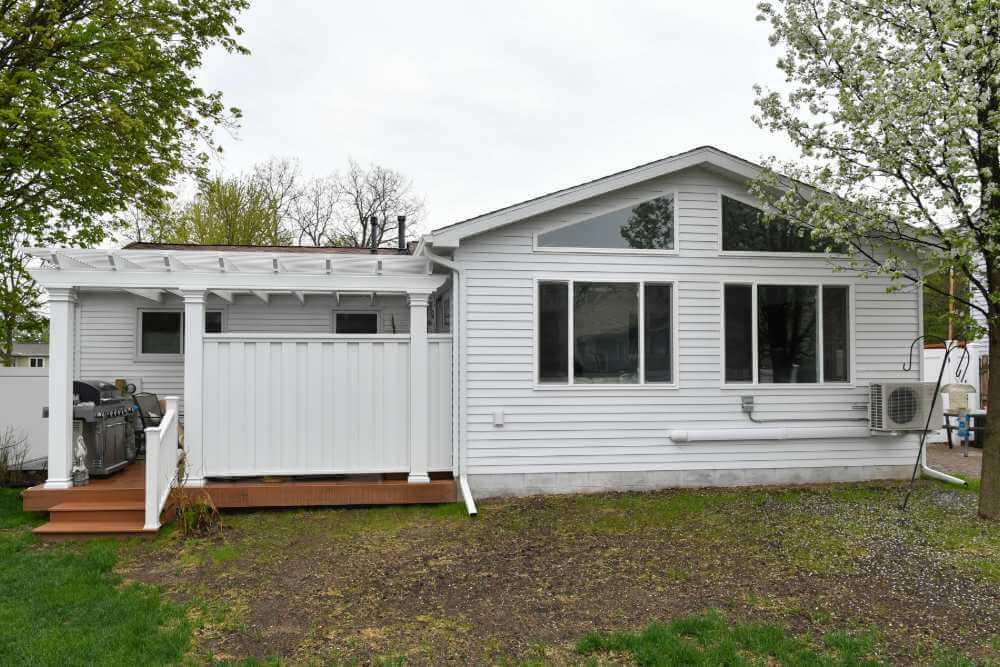 Custom backyard addition with modern windows built by Odd Fellows Contracting in Lansing Michigan