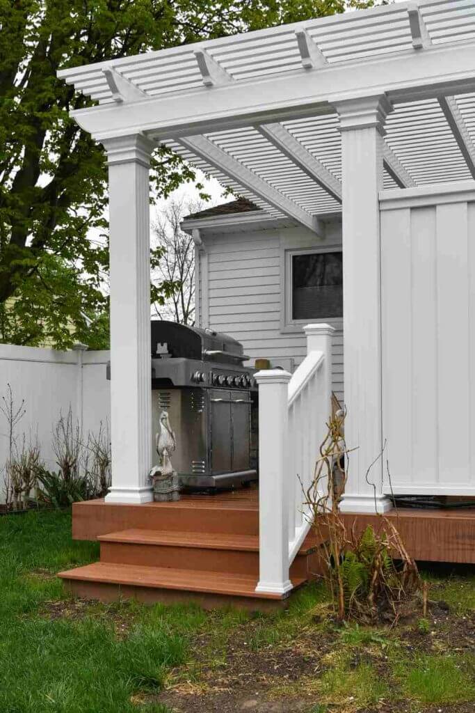 Outdoor deck and pergola attached to new home addition in Lansing MI